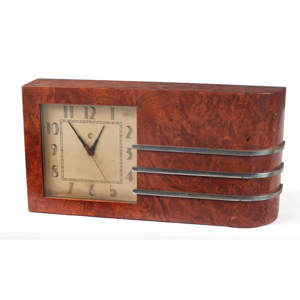 Gilbert Rohde clock, 1933 World's Fair: Gilbert Rohde clock, by Howard Miller, 1933, Maidou burl case with polished metal banded trim, original finish, metal tag reads "1933 A Century of Progress Chicago. Original Design World's Fair Clocks