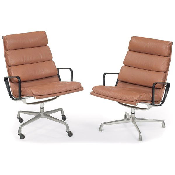 Eames Soft Pad chairs, 2, tan, one w/ castors: Charles & Ray Eames Soft Pad lounge chairs, by Herman Miller, pair, high-back version upholstered in original tan leather in an aluminum frame with black armrests, early four-point base, swivel mechan