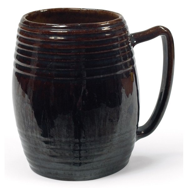 George Ohr: George Ohr handled vessel, hand-thrown with a single handle, covered in a brown high glaze, signed, 6"w x 5.5"h