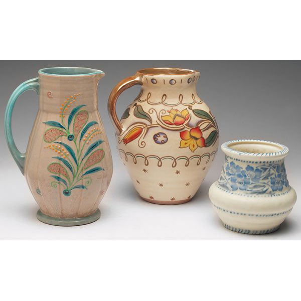 Charlotte Rhead: Charlotte Rhead handled vessel, ribbed shape in a peach and blue glaze with a colorful squeeze bag design, 6"w x 9"h; with a Charlotte Rhead handled vessel, bulbous shape in a ivory matt glaze with a