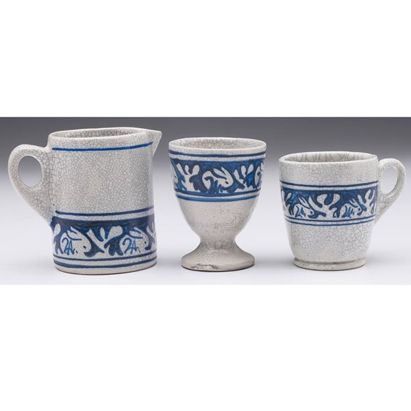 Dedham Pottery two handled vessel: Dedham Pottery two handled vessels and egg cup, lot of three, all decorated with rabbits, tallest: 3”h, marked