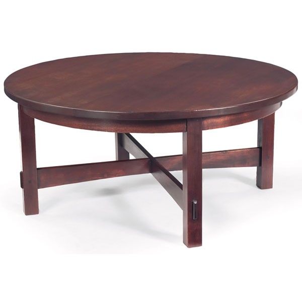 Arts and Crafts style coffee table, mahogany, a cu: Arts and Crafts style coffee table, in mahogany, a cut-down Stickley Brothers table, circular top on a cross-stretcher base with thru-tenon construction, signed with Quaint metal tag, refinished, 42"d