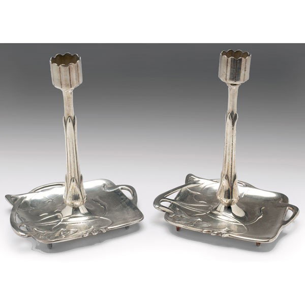 Art Nouveau candle holders, pair, silver flower fo: Art Nouveau candle holders, pair, silver flower form holders on square trays with cut out sides and stylized flowers and leaves, signed "Geschutzt," 7"h x 5.5"l x 4.5"w