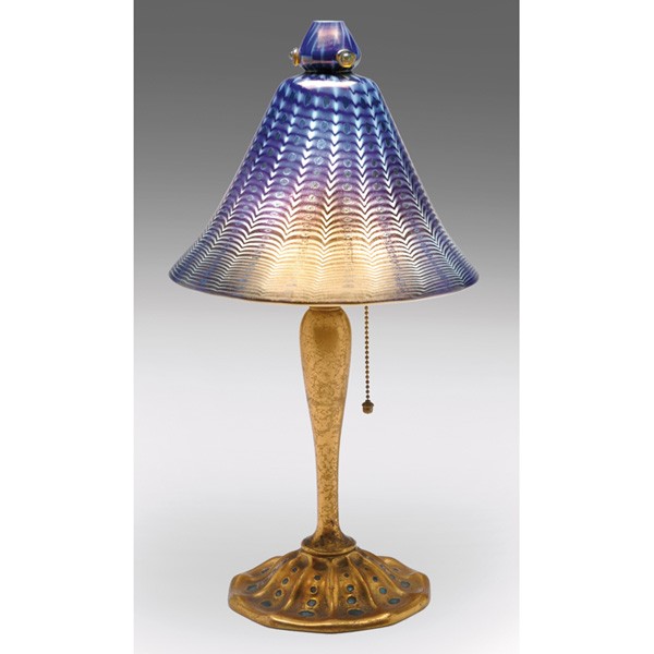 Tiffany Studios lamp, favrile glass shade blue and: Tiffany Studios lamp, favrile glass shade in blue and white with iridescent accents, held by a bronze base with enameled accents and an original gold dore patina, shade signed L.C.T. Favrile, base sig