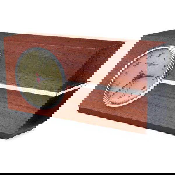 Gilbert Rohde clock, by Herman Miller: Gilbert Rohde clock, by Herman Miller, wood case with curved glass dial cover, chrome trim, marked "Herman Miller" on face and with label on back, refinished, 10.5"w x 3"d x 5.5"h, very good condition