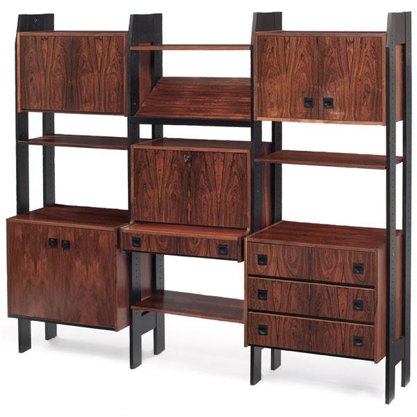 1960s Modern freestanding wall unit, rosewood: 1960s Modern freestanding wall unit, rosewood, vertical wood supports with open framework support 5 cabinets and 4 shelves and one magazine rack shelf, two two-door cabinets, one cabinet with three dr