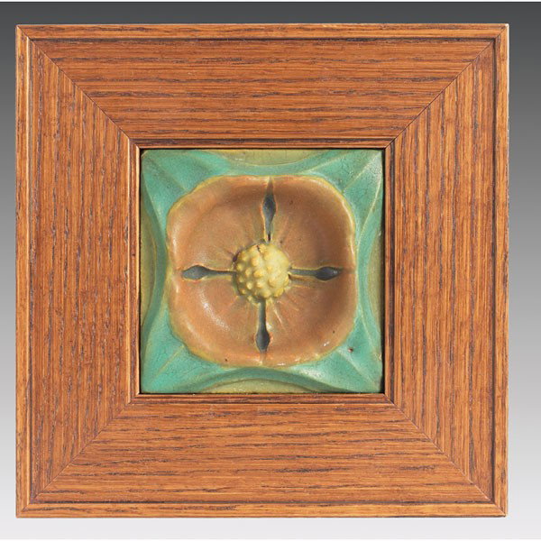 Rookwood Faience tile, large and colorful stylized: Rookwood Faience tile, large and colorful stylized floral design in high relief, marked, held in an Arts and Crafts oak frame, tile: 5"sq, overall: 8"sq