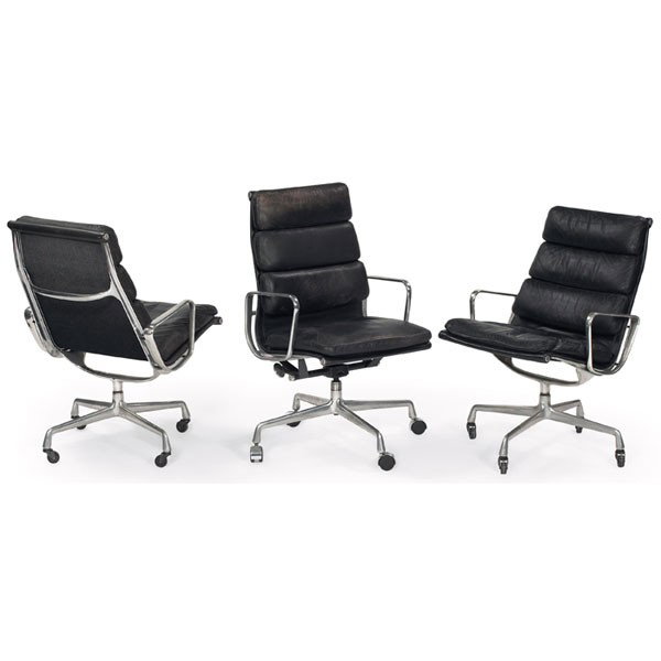 Charles and Ray Eames Soft Pad chairs, by Herman M: Charles and Ray Eames Soft Pad chairs, by Herman Miller, three, high-back version upholstered in original black leather in an aluminum frame, one Executive chair and two lounge chairs, early four-poin