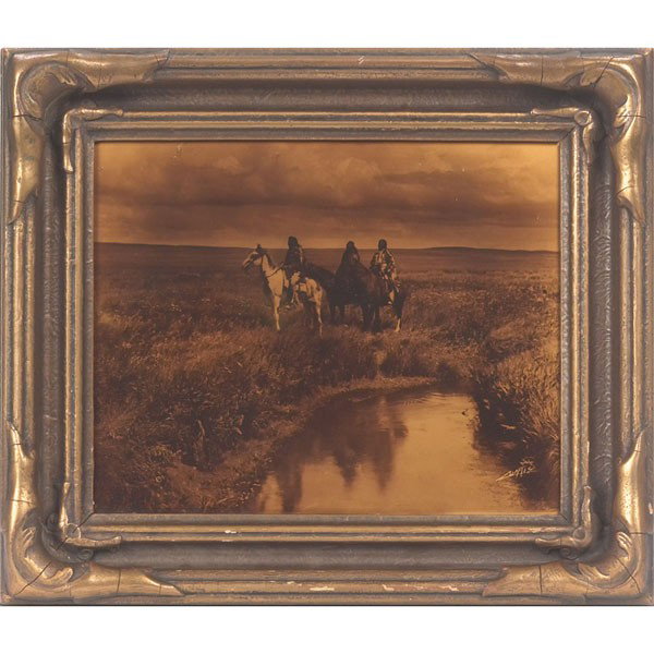 Edward Sheriff Curtis orotone, "Three Chiefs," dra: Edward Sheriff Curtis orotone, "Three Chiefs," dramatic image signed in negative lower right, original label attached to verso, 8" x 10", held in original Curtis Studios frame