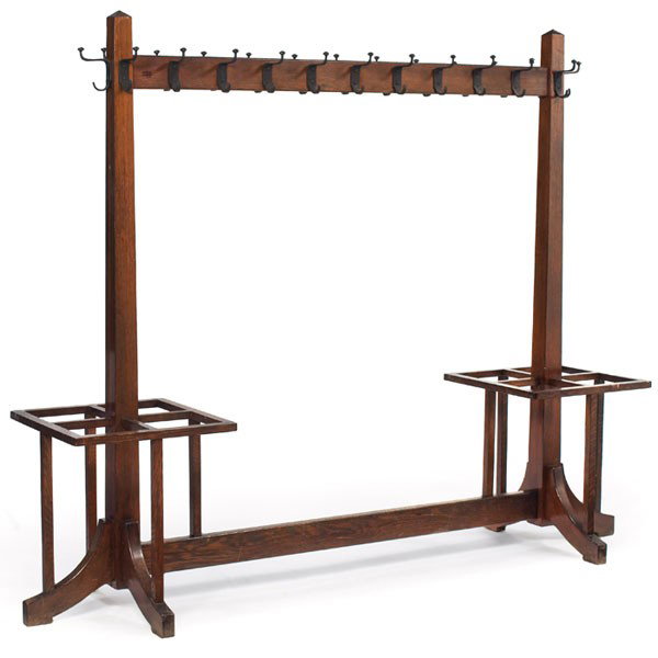 Arts and Crafts costumer, large form with 24 hooks: Arts and Crafts costumer, large form with 24 hooks at top and peaked posts over lower umbrella compartments, recoated original finish, 91"w x 21"d x 72.5"h, very good condition