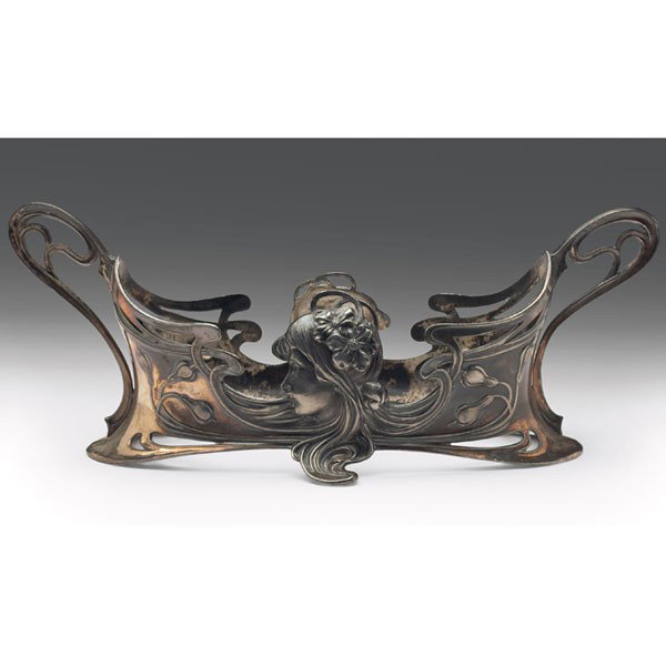 WMF dish holder, double handled form, silvered pew: WMF dish holder, double handled form, silvered pewter Art Nouveau design of maiden profile on each side among scrolls, marked, #590, c. 1906, 5"w x 11.5"l x 4.5"h, missing inner dish