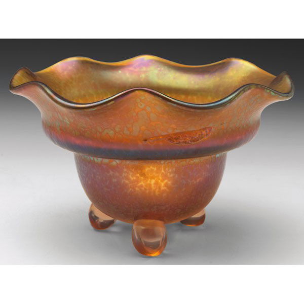 Loetz vase, footed form with scalloped rim in a am: Loetz vase, footed form with scalloped rim in a amber glass with all over iridescence, designed by Michael Powolny, c. 1912, 6"w x 3.5"h