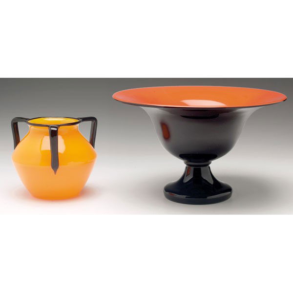 Loetz Tango vase, waisted form in orange-yellow gl: Loetz Tango vase, waisted form in orange-yellow glass with three applied black handles and rim, 4.5"h; with a Loetz Tango vase, flaring form in black glass with orange-red interior, 10"w x 6"h