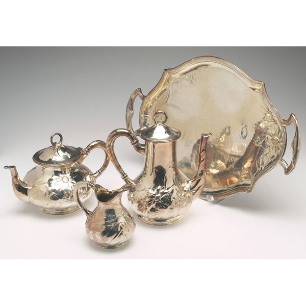 F.H. Schmitz tea-set: F.H. Schmitz tea-set, consists of a teapot, coffee pot, creamer with a two handle tray, silver-plated pewter, all decorated with stylized sunflowers, marked "Orivit," tallest is: 10", tray: 20"l