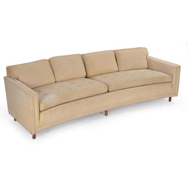 Edward Wormley sofa, by Dunbar: Edward Wormley sofa, by Dunbar, large curved form with tufted seat cushions and down-filled back cushions, six mahogany legs, original off-white upholstery, signed with Dunbar fabric in decking, 97.5"