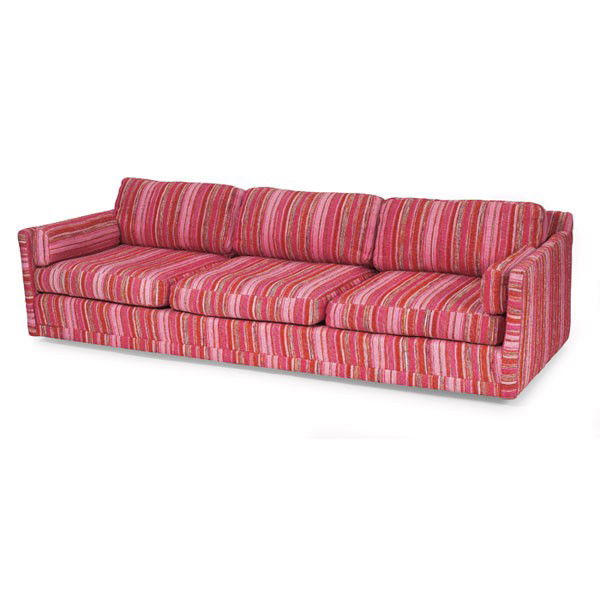 Selig sofa: Selig sofa, long, low form covered in the original multi-colored woven silk upholstery, castors to front, legs to back, signed with Selig label, 90"w x 33"d x 24"h, excellent original condition