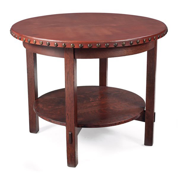 L and JG Stickley lamp table, #542: L and JG Stickley lamp table, #542, circular top over a lower shelf supported by thru-tenon construction, nicely replaced leather top, refinished, signed with Handcraft decal, 36"dia x 30"h, very good