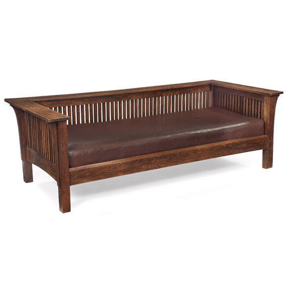 L & JG Stickley settle, Prairie form: Contemporary L & JG Stickley settle, Prairie form with spindled back and sides with corbel supports, recovered leather cushion with three matching pillows, some wear to finish, 82.5"w x 38"d x 27"h, v