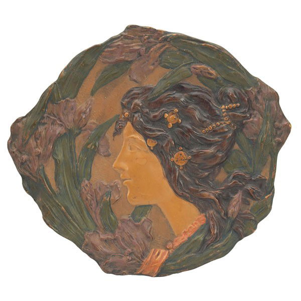 Amphora plaque, female, with an Austrian plaque: Amphora plaque, by the Ernst & Wahliss Co., nicely executed design of a female profile among irises, marked, #172, 11.5"w, chip to back; with an Austrian plaque, (not shown), reproduction, detailed ca