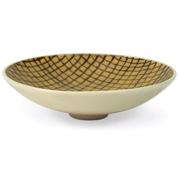 Stephen Polchert ceramic bowl: Stephen Polchert ceramic bowl, USA, 1953, footed form with clear glaze to exterior and interior glazed with a mesh-like design in brown and yellow, signed "S. Polchert 2-53", 10.75"dia x 3"h, mint con