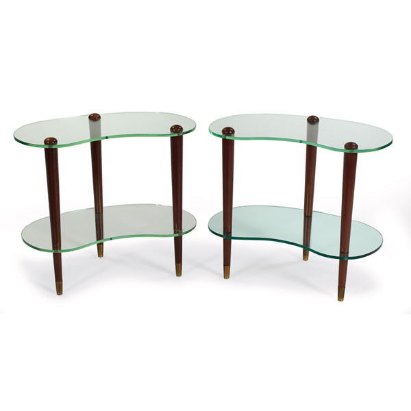 Gilbert Rohde Cloud tables, pair: Gilbert Rohde Cloud tables, pair, by Herman Miller, biomorphic green glass tops connected by wood dowel legs, brass caps to feet, original finish, 24"w x 14.5"d x 21.5"h, one glass shelf replaced, ver