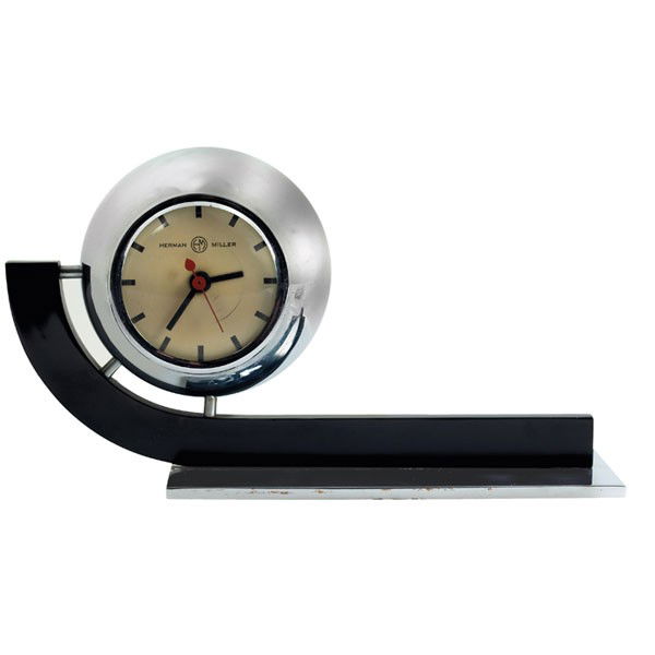 Gilbert Rohde table clock, curved bronze: Gilbert Rohde table clock, by Herman Miller, 1930s, chrome-plated steel ball is suspended over a curved bronze support with black finish, aluminum base, 11.5"w x 5"d x 6.5"h, very light wear, overall