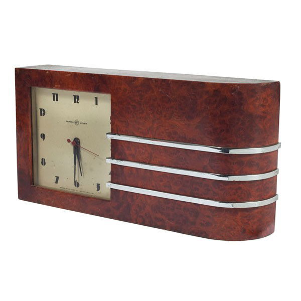 Gilbert Rohde table clock, burled wood: Gilbert Rohde table clock, by Herman Miller, 1930s, burled wood case with banded chrome trim, Art Deco numerals, original finish, signed on dial, 13"w x 2.5"d x 6.75"h, some wear, very good original c