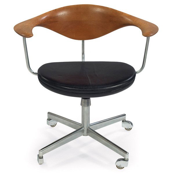 Hans Wegner Swivel chair: Hans Wegner Swivel chair, by Johannes Hansen, Denmark, c.1960, solid oak backrest, original black leather upholstery, polished die-cast steel base with four legs on castors, seat height adjusts, signe