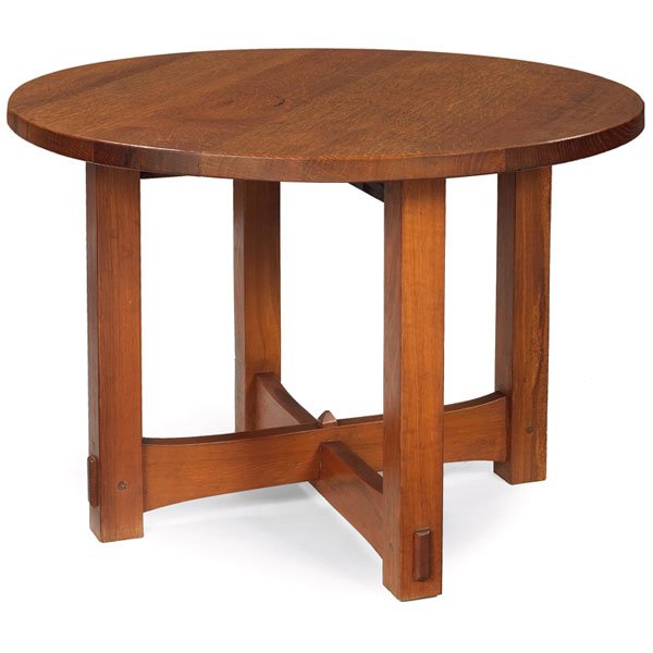 Gustav Stickley library table, Model No. 436: La Hacienda: The John L. Jerome Collection: 1902 Gustav Stickley library table, Model No. 436, cut down, circular top above a stacked trumpeted cross-stretcher base with central faceted peg supported 