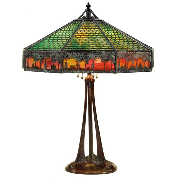 Handel lamp, nine-sided slag glass shade : La Hacienda: The John L. Jerome Collection: Handel lamp, nine-sided slag glass shade with brick and landscape overlay design, on a bronze base, break to one glass panel, shade signed, 22"w x 26"h, ver