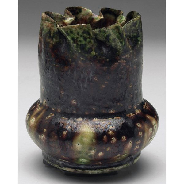 George Ohr vase: George Ohr vase, unusual form with a crimped rim, covered in a mottled brown and green matte glaze, signed, 3"w x 3.5"h, minor flaws to base
