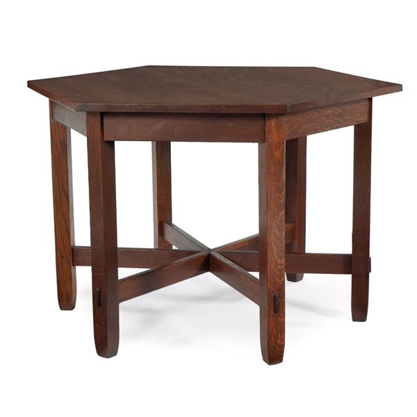 Stickley Brothers library table: Stickley Brothers library table, hexagonal top above six tapered legs with thru-tenon construction, refinished, unsigned, 46.5"w x 40"d x 30"h, very good condition