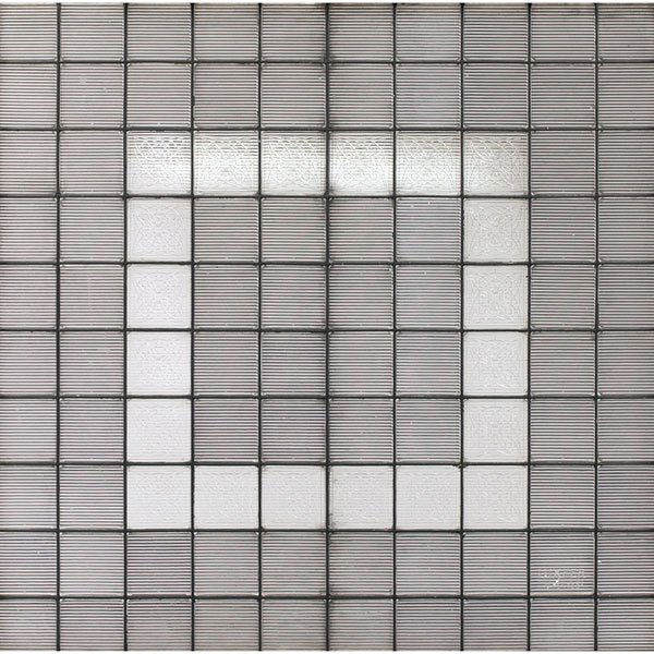 Luxfer prism window: Luxfer prism window, 100 prisms held together with leaded glass, twenty Frank Lloyd Wright designed-prisms make up the central border, one signed Luxfer, glass: 39.5"w x 40"h, very good condition