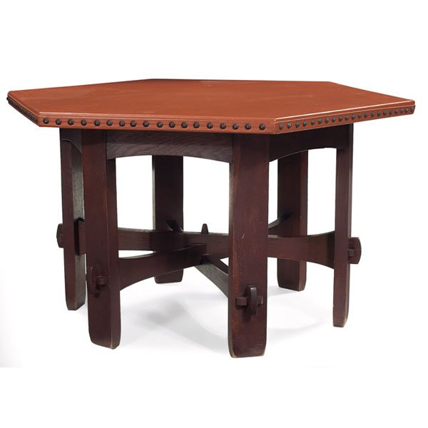 Gustav Stickley table, #410-L, hexagonal: Early Gustav Stickley table, #410-L, hexagonal leather top above an arched apron, stacked trumpeted stretcher base supported by key and tenon construction with a central faceted peg, good original fin