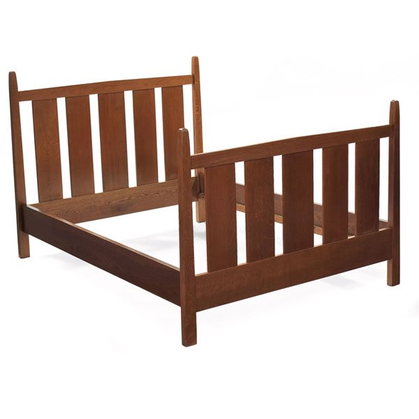 Gustav Stickley bed, #923, double-size: Good Gustav Stickley bed, #923, double-size with peaked rails above five wide vertical slats supported by reverse-tapered posts, original light finish, signed with red decal, 57"w x 78.5"l x 48.5"h, v