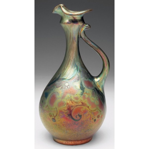 Delphin Massier handled vessel, attribution: Delphin Massier handled vessel, attribution, bulbous shape with a stylized leaf and berry design, covered in a metallic glaze, marked illegibly, 5"w x 9"h