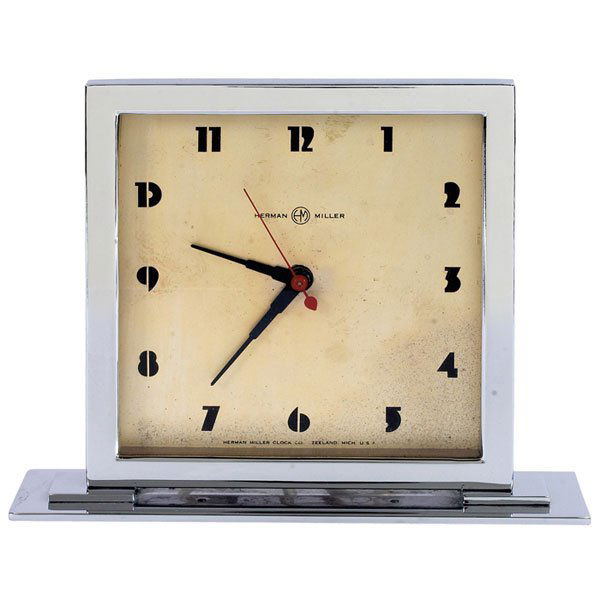 Gilbert Rohde Art Deco table clock, by Howard Mill: Gilbert Rohde Art Deco table clock, by Howard Miller, 1930s, square chromed metal case, stylized Art Deco numerals, original red second hand, signed, 8"w x 2.5"d x 6.5"h, light wear to the surface of