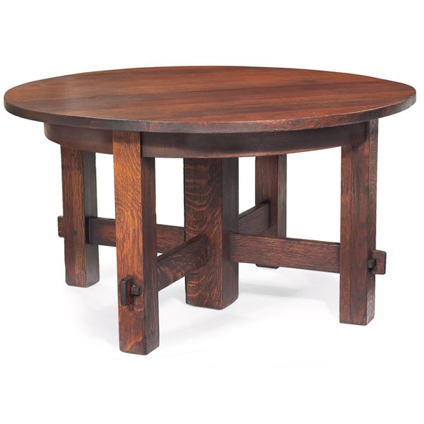 Gustav Stickley dining table, key and tenon,oak, un: Early Gustav Stickley dining table, similar to #634, circular top above five legs with cross stretchers supported by key and tenon construction, four 11" quarter-sawn oak leaves in original case, refi