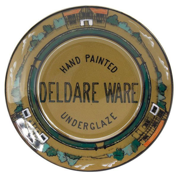 Buffalo Pottery Deldare Ware advertising plate, ini: Unusual Buffalo Pottery Deldare Ware advertising plate, painted design of three buildings, marked, initials M.H., 6.5"dia