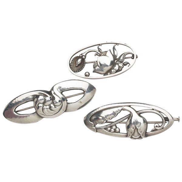 Georg Jensen pins, three, #40, #274: Georg Jensen pins, three, organic looping design, #40, 2.25"w; floral design, #274, 1.75"w; stylized tulip design, #178, all in sterling silver, all marked