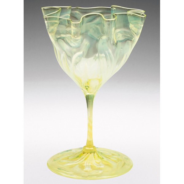 James Powell & Sons vase, attribution, tinted yell: James Powell & Sons vase, attribution, tinted yellow glass with a ruffled rim and a broad foot, textured opalescent designs, unmarked, 6"w x 8.5"h, minor chips to edge of foot. Reference: A similar va