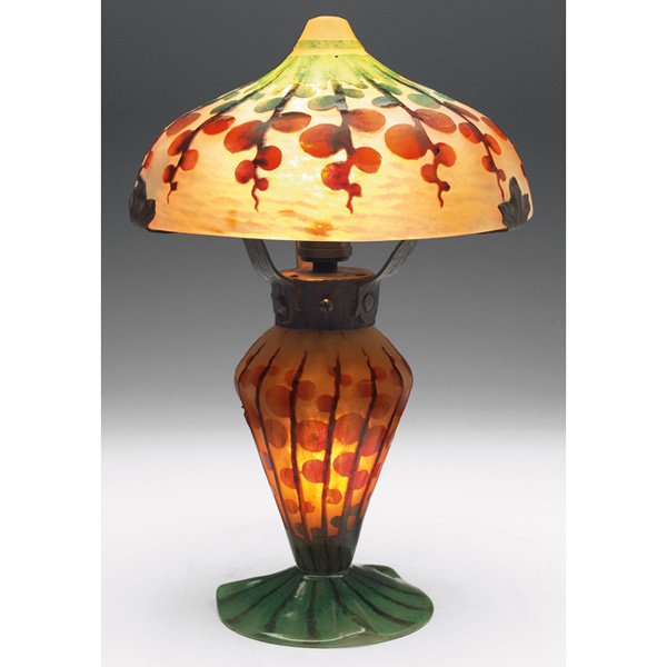 Le Verre Francais lamp, cameo cut, organic design : Le Verre Francais lamp, cameo cut and colorful stylized organic design against a frosted ground, marked, original wrought iron hardware with its original patina, overall: 8"w x 12.5"h, both shade and 
