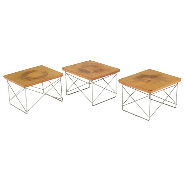 Charles & Ray Eames LTR tables, three stained tops: Charles and Ray Eames LTRs, three, birch tops over zinc frames, one signed with round metal tag, each is 15.5"w x 18.75"d x 14"h, stains to tops, fair condition. The Collection of Mort and Millie Gold