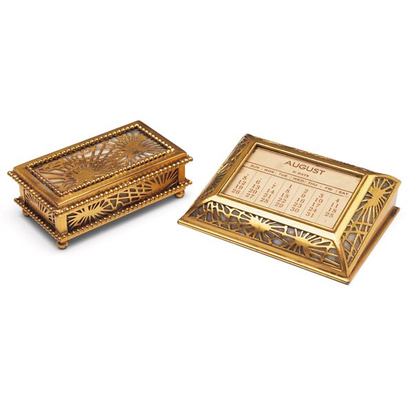 Tiffany Studios stamp box: Tiffany Studios stamp box, #801, 4.25"l x 1.5"h; with a Tiffany Studios frame, #930, 4.75"w x 1.5"h, both with an original gold dore patina, both in the pine needle pattern, both signed Tiffany Studio