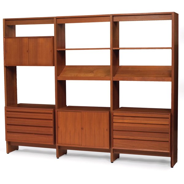 Poul Cadovius CADO wall unit: Poul Cadovius CADO wall unit, Denmark, teak, three bays formed by four uprights, four cabinets (two with sliding doors and two with drawers) and six flat shelves two angled shelves, two light fixtures