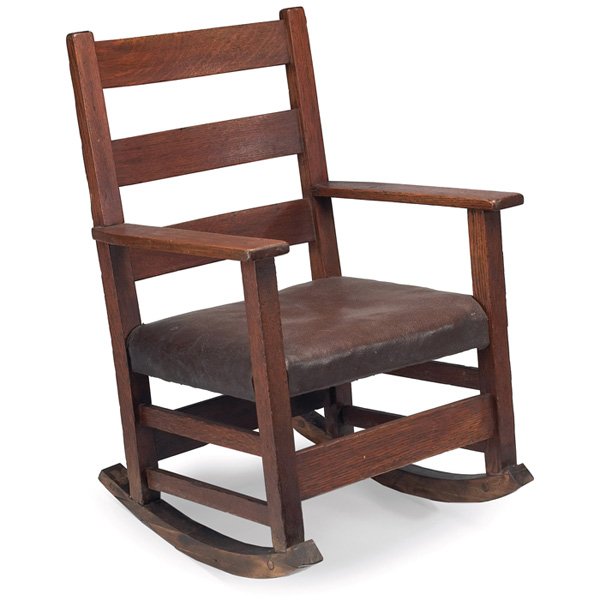 Gustav Stickley child's rocker: Gustav Stickley child's rocker, #343, three horizontal slats at back above an original leatherette seat, recoated finish, rockers replaced, unsigned, 18"w x 18.5"d x 24.5"h, good condition