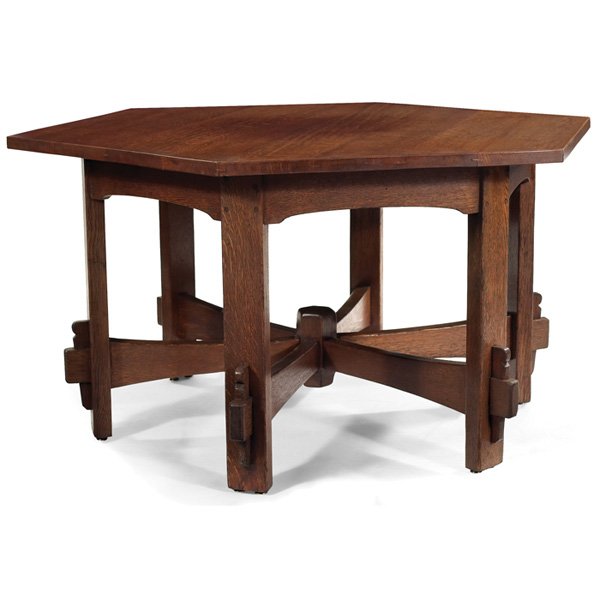 L & JG Stickley table: L & JG Stickley table, #563, hexagonal top above a wagon wheel base with central peg and supported by key and tenon construction, singed "The Work of..." refinished, 48"w x 55.5"d x 28.5"h, very good 