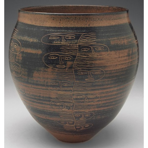 Edwin and Mary Scheier vase brown and black matte glaze: Exceptional Edwin and Mary Scheier vase, large form covered in a brown and black matte glaze with incised stylized faces, signed, 10"w x 10"h, probably circa 1940s