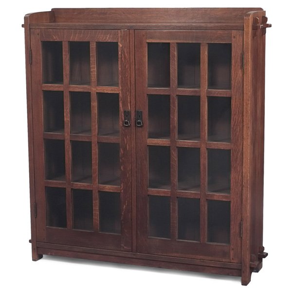 L & JG Stickley bookcase: L & JG Stickley bookcase, #645, two-door form with twelve panes of glass per door and original hardware, slab sides supported by double key and tenon construction, signed with Handcraft decal, lightly