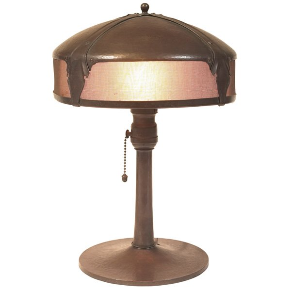 Roycroft lamp copper: Roycroft lamp, copper and mesh-lined shade with riveted straps on a column base, some damage to liner, signed, original patina 10"dia x 14"h